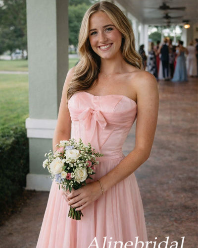 Woman in a pink strapless dress holding flowers, with 'Alinebridal' branding.